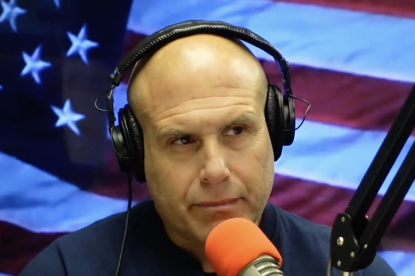 Lee Elci behind the microphone in his radio studio